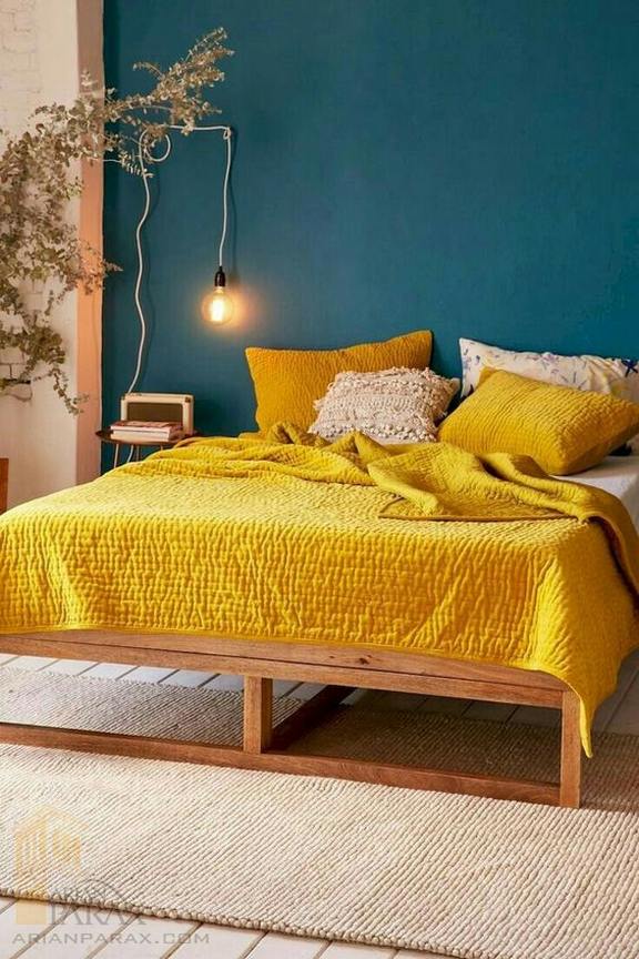 05-a-teal-wall-and-bright-yellow-bedding-create-a.jpg