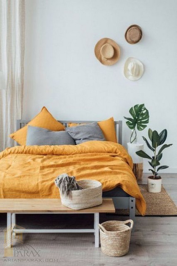06-a-boho-bedroom-with-grey-and-yellow-bedding-tha.jpg